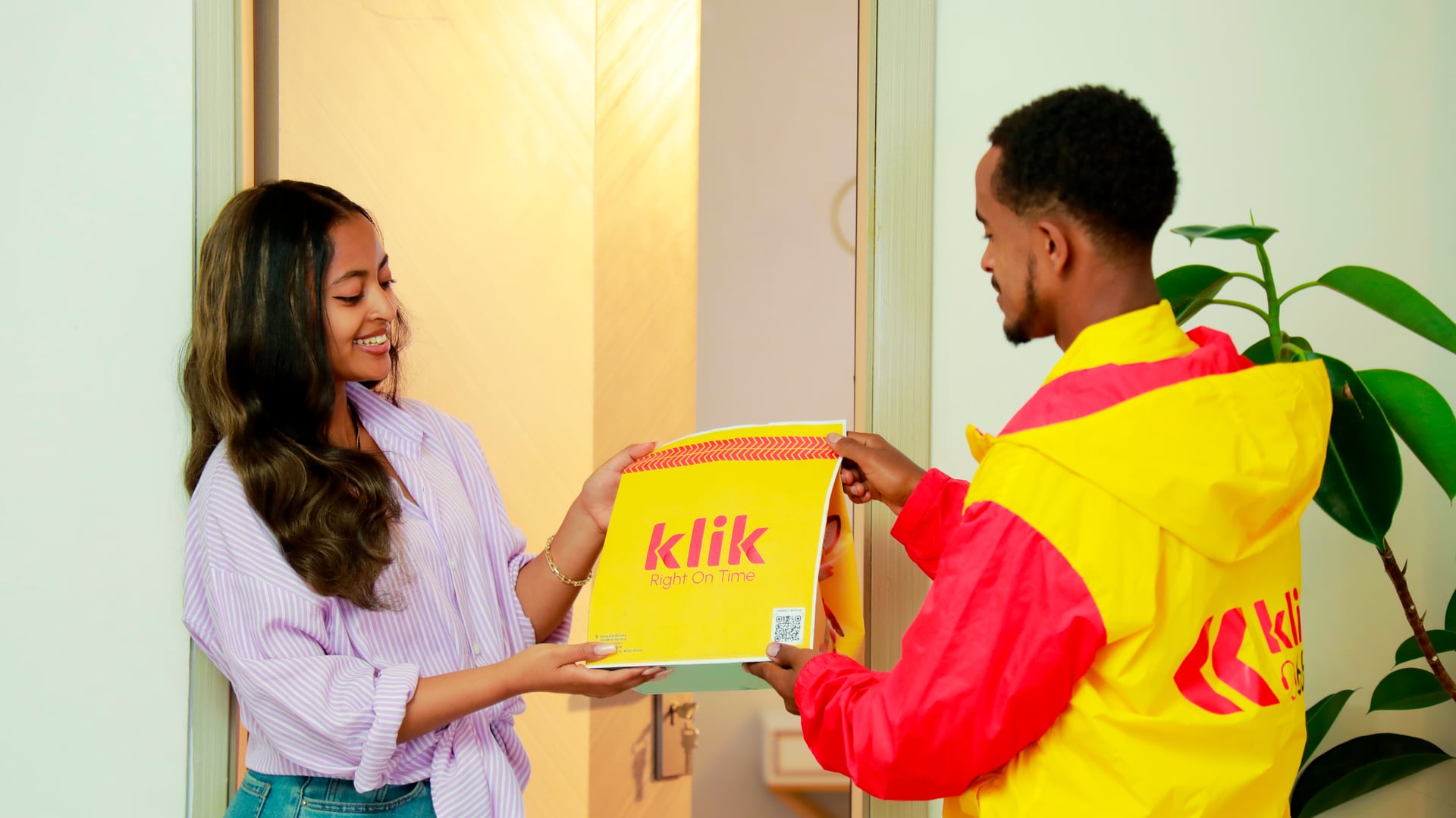A klik customer receiving a delivery at home in Addis Ababa