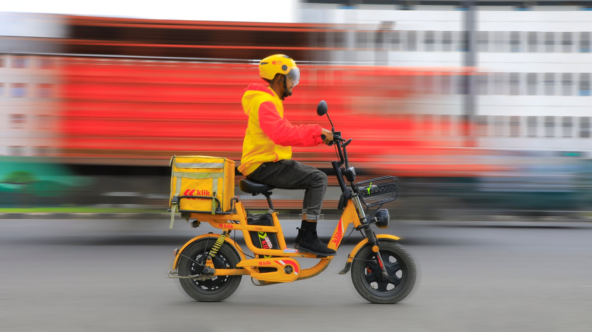 A klik rider on an electric bike in Addis Ababa